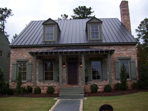 red brick house with brown metal roof|siding colors with brown roof.